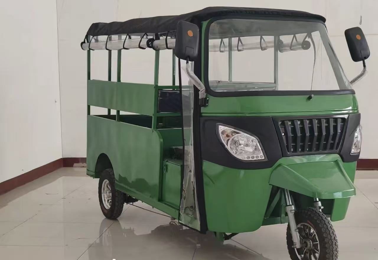 Green electric three-wheeler with passenger seating